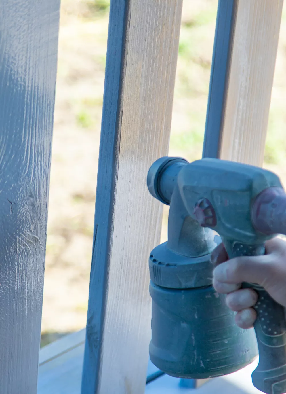 Spray painting a fence